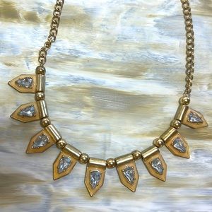 Gold necklace with gem stones.